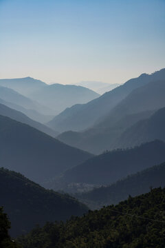 Silhouetted view of the foothills of the Himalayas between the Rishikesh and Devprayag in the Ganges Valley; Uttarakhand, India