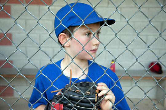 Young boy playing baseball; Tuxedo, New York, United States of America