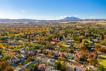 Drone photo over a community in California with beautiful fall colors and houses