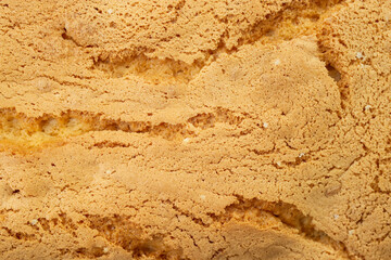 sponge cake crust texture with cracks, soft focus - obrazy, fototapety, plakaty