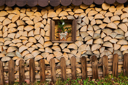 Decorated window in a wood pile at Mount Vapec, Klein Fatra, Carpathian Mountains; Horna Poruba, Slovakia