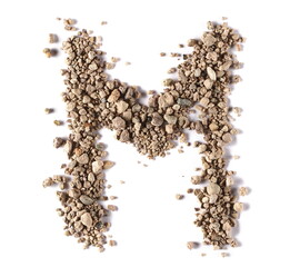 Clods of dry dirt, alphabet letter M, soil isolated on white, clipping path - obrazy, fototapety, plakaty