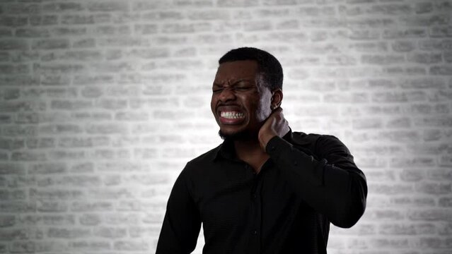 Man feels neck pain after woke up in morning, uncomfortable matrass, closeup