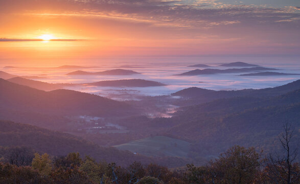 Autumn morning mist shrouds the Shenandoah Mountains in the Blue Ridge Mountains of Virginia.