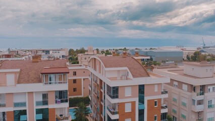 Top view of resort town on the background of the sea. Aerial drone view of houses and hotels