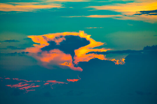 Sunset cloud formation at dusk over the Solomon Sea off Morobe Province, Papua New Guinea; Morobe Province, Papua New Guinea