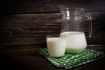 Fresh milk on old background