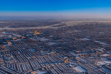 Aerial view of the cityscape of Montreal on a cold winter morning with snowy rooftops; Montreal, Quebec, Canada