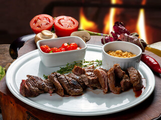 sliced grilled steak served , Picanha