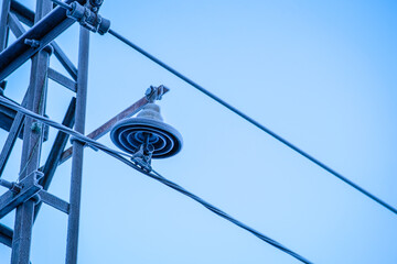Frosted electric wires in winter. Power supply disturbances in winter, in the cold. Defocused