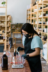 Laboratory employee performing the procedure for the creation of handcrafted products.