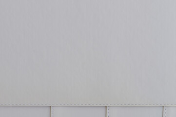 White leather background with stitches