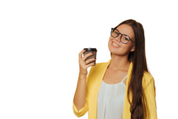 Cute girl dressed in yellow jacket and glasses holding cup of coffee, smiling broadly over transparent background with a copy space. Advertisement concept. Mockup, pretty italian young woman relaxing.