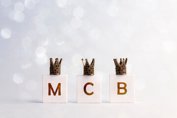 Happy Three King's Day. Three letters M, C, B with crowns on light background. Letters M, C, B...