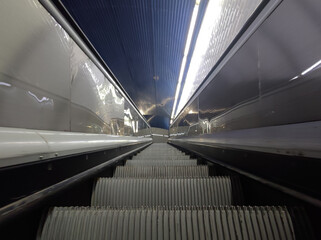 low angle picture of an escalator in modern subway station
