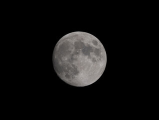 Obraz premium Moon just before Full, Waxing Gibbous with craters visible.