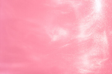 delicate pink background with sequins waves liquid motion