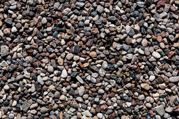 Texture background of small stones close-up, crushed stone, pebbles.