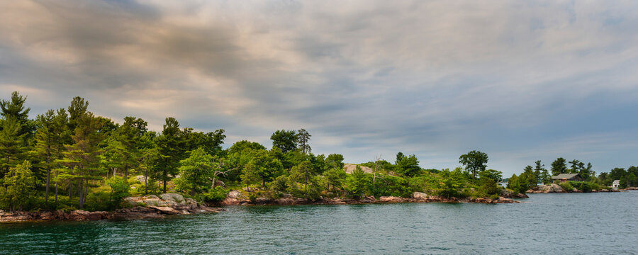 Shoreline of an island in the Thousand Islands, a North American archipelago of 1,864 islands that straddles the Canada&ndash;US border in the Saint Lawrence River; Ontario, Canada