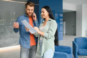 Business partners meeting in office lobby