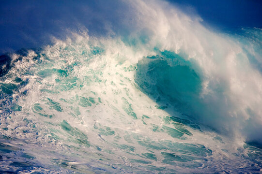 Dramatic view of wave breaking at Peahi on Maui's North Shore; Maui, Hawaii, United States of America