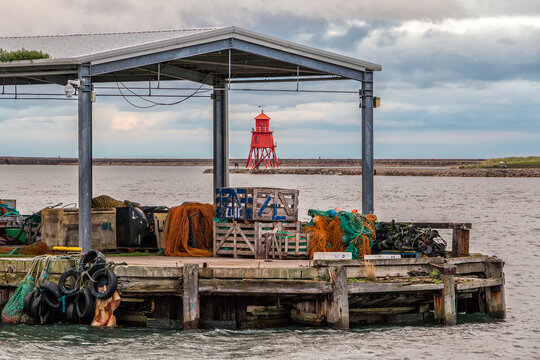 View of the groyne through the jetty which carries a variety of fishing paraphernalia; North Shields, Tyne and Wear, England