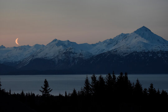 Moonrise over Kachemak Bay and the Kenai Mountains, Alaska, USA; Homer, Alaska, United States of America