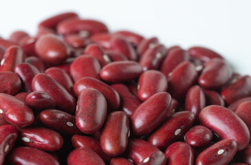Pile set of red bean, red grain beans pouring down abstract cloud group. Beautiful complete seed pea bean, food object design. Selective focus freeze shot white background isolated
