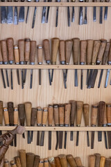 exhibitor with several gouges to carving wood