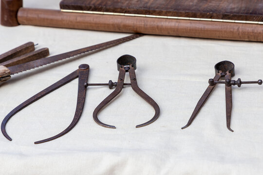 closeup of three craftsman carpenter compasses