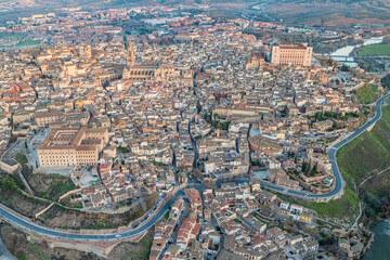 Aerial views of the city of Toledo during a sunrise on a clear and sunny day