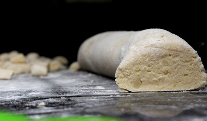 raw dough to make homemade gnocchi. gnocchi dough texture. raw dough to prepare the meal.
