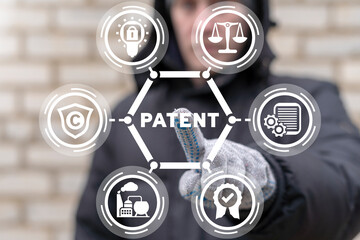 Engineer using virtual touchscreen presses word: PATENT. Patent Regulations Management Production...
