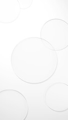 白背景に円形のガラスが複数配置された画像。俯瞰。（縦長）