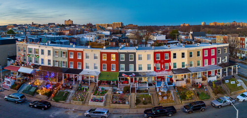 Famous holiday Christmas light block on 34th street in Baltimore with colorful row houses, lights...