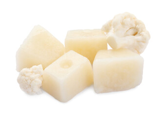 Frozen cauliflower puree cubes and fresh cauliflower isolated on white