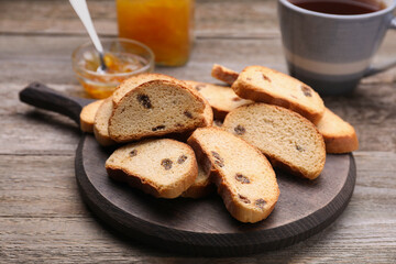 Sweet hard chuck crackers with raisins on wooden table
