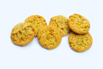 pistachio and almond cookies on white background.