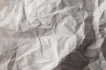 Crumpled sheet of paper as background, top view