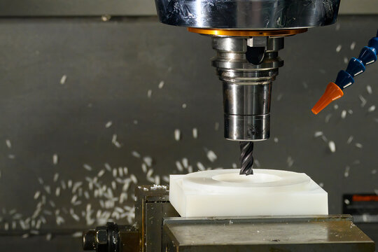 The  CNC milling machine cutting the nylon 6 material part with ball end mill tool.