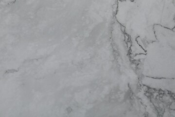 Texture of light grey marble surface as background, closeup