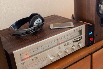 Home Stereo Receiver with Speakers and Headphones Placed on Wooden Retro Shelf - 556843346
