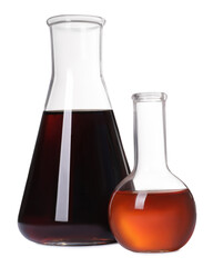 Laboratory glassware with brown liquids on white background