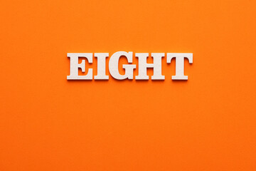 In white letters the word eight on an orange background