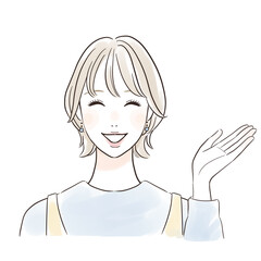 笑顔で案内するカジュアルな女性