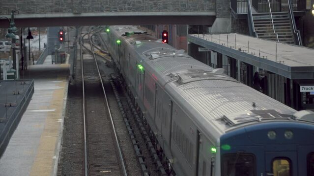 Train Departing Station on Cold Winter Day