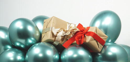 turquoise balloons and gifts with brown wrapping paper