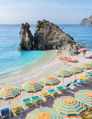Pebble beach Monterosso vacation Cinque Terre Monterosso al Mare Chairs and umbrellas fill the...