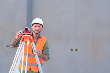 Survey engineers at construction sites use theodolite to mark coordinating concrete piles.