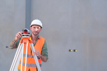 Survey engineers at construction sites use theodolite to mark coordinating concrete piles.